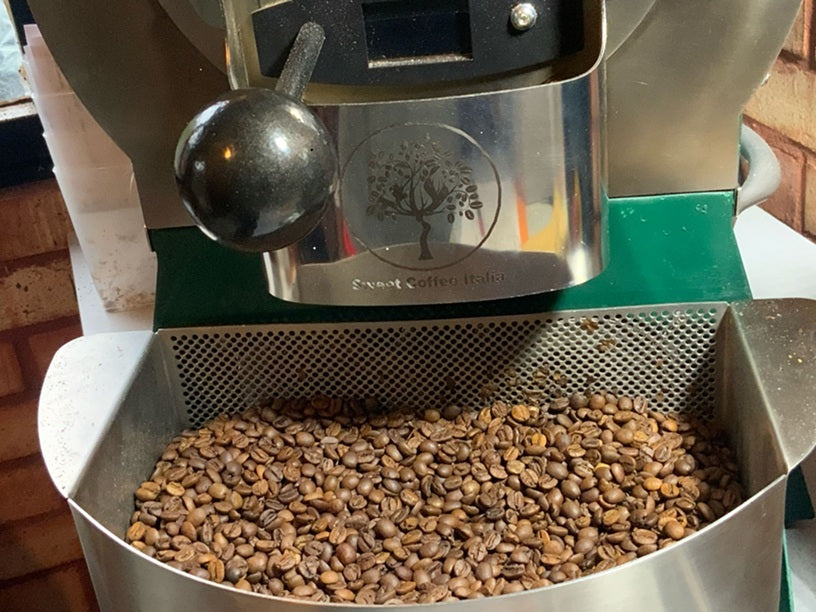 Small batch specialty coffee beans being hand roasted in the UK